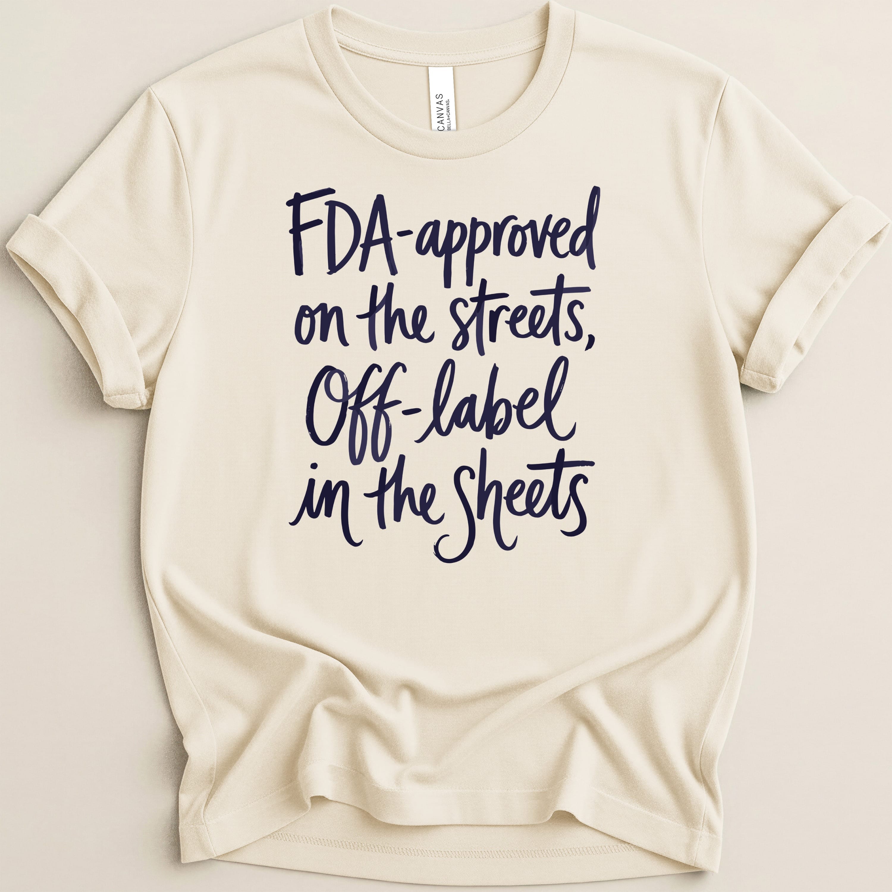 Cream t-shirt with navy text: "FDA-approved on the streets, Off-label in the Sheets".