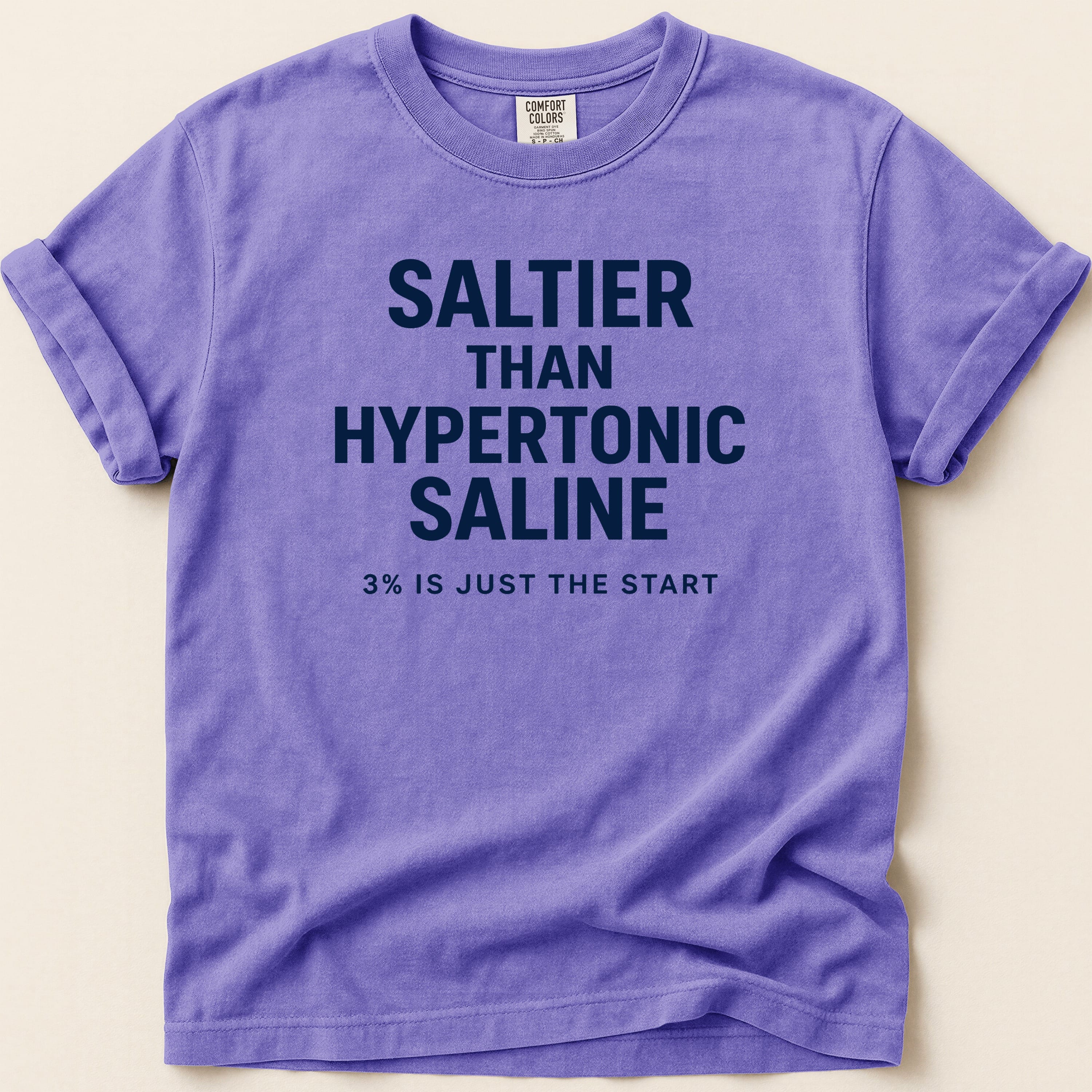 Purple t-shirt with "SALTIER THAN HYPERTONIC SALINE 3% IS JUST THE START" text.