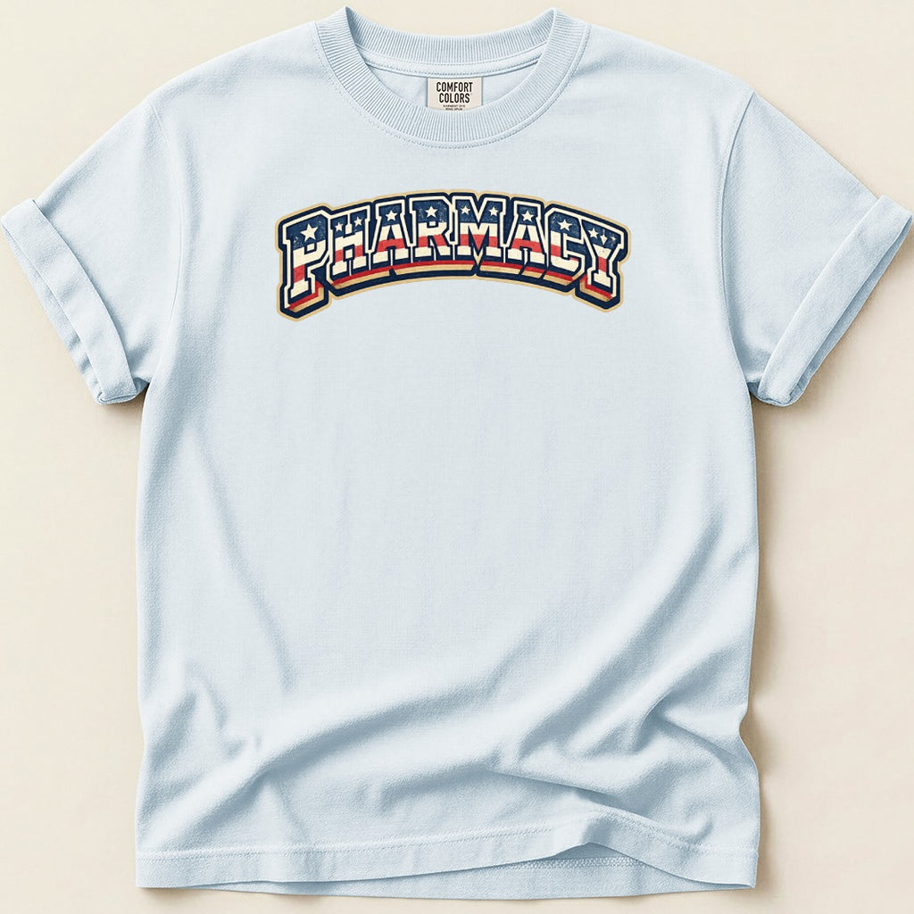 Light blue t-shirt with "PHARMACY" in arched, red, white, and blue striped lettering.