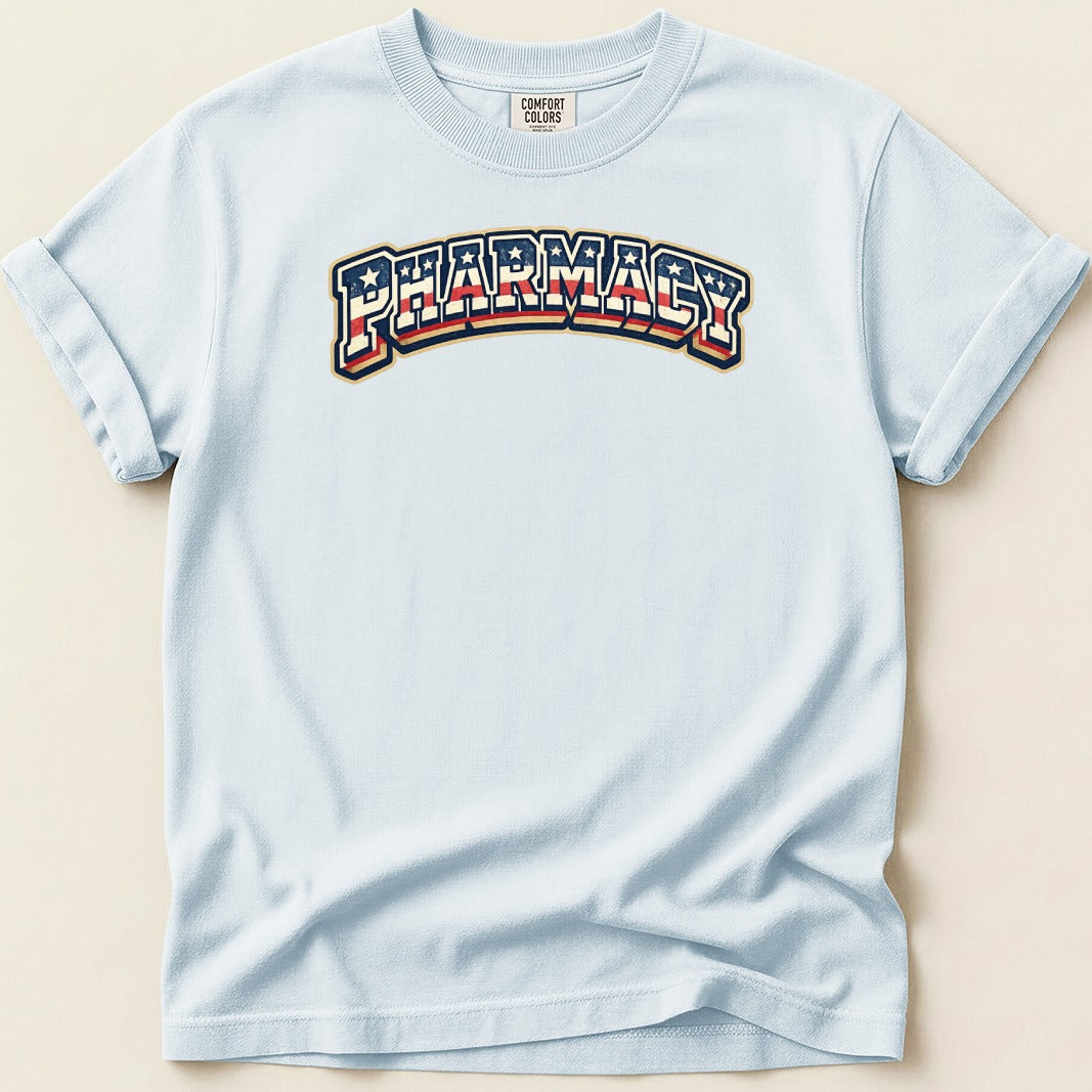 Light blue t-shirt with "PHARMACY" in arched, red, white, and blue striped lettering.