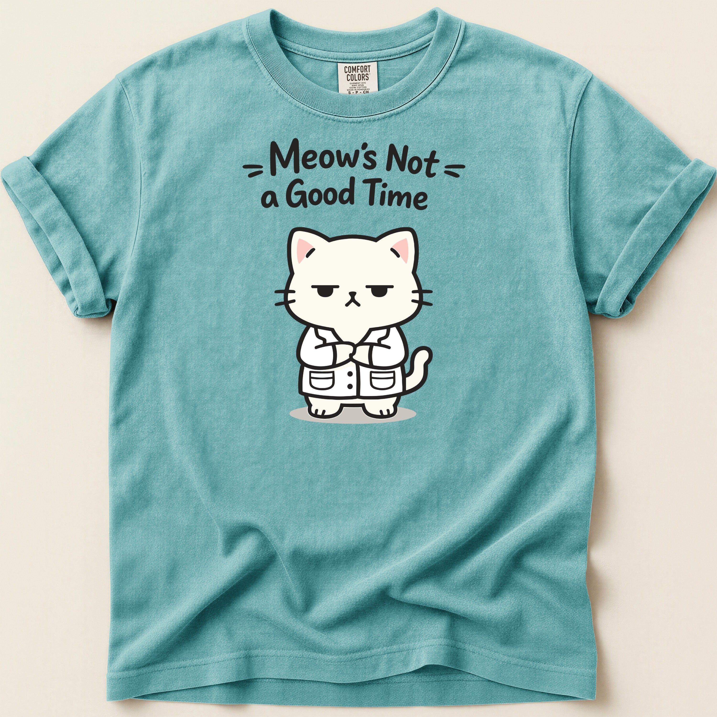 T-shirt with a grumpy white cat wearing a lab coat, text reads "Meow's Not a Good Time".