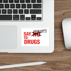 Red sticker on laptop keyboard reads "SAY PERHAPS TO DRUGS".
