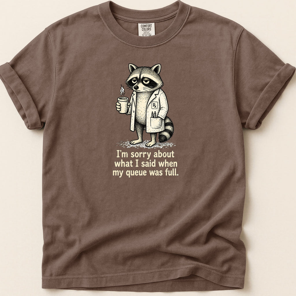 T-shirt with a raccoon in a lab coat holding coffee and text.