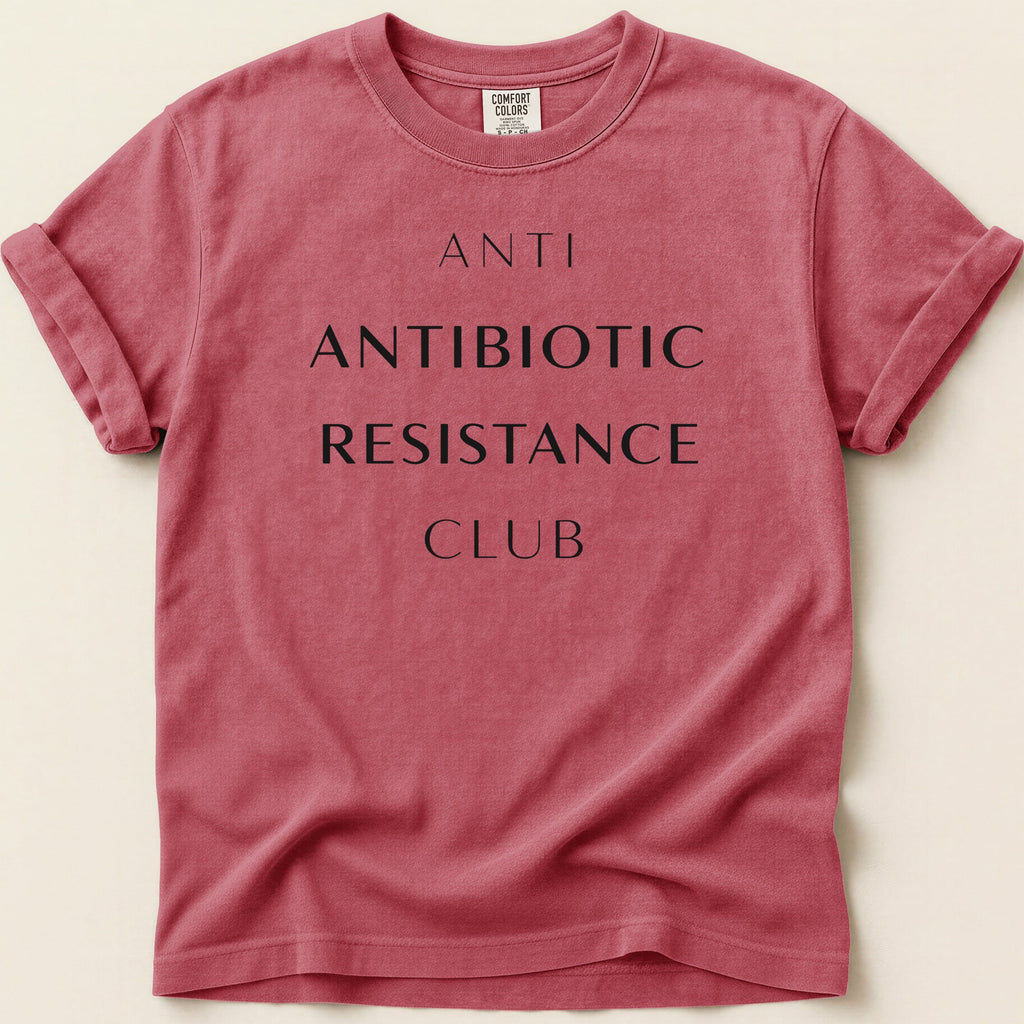 Red t-shirt with "ANTI ANTIBIOTIC RESISTANCE CLUB" text.