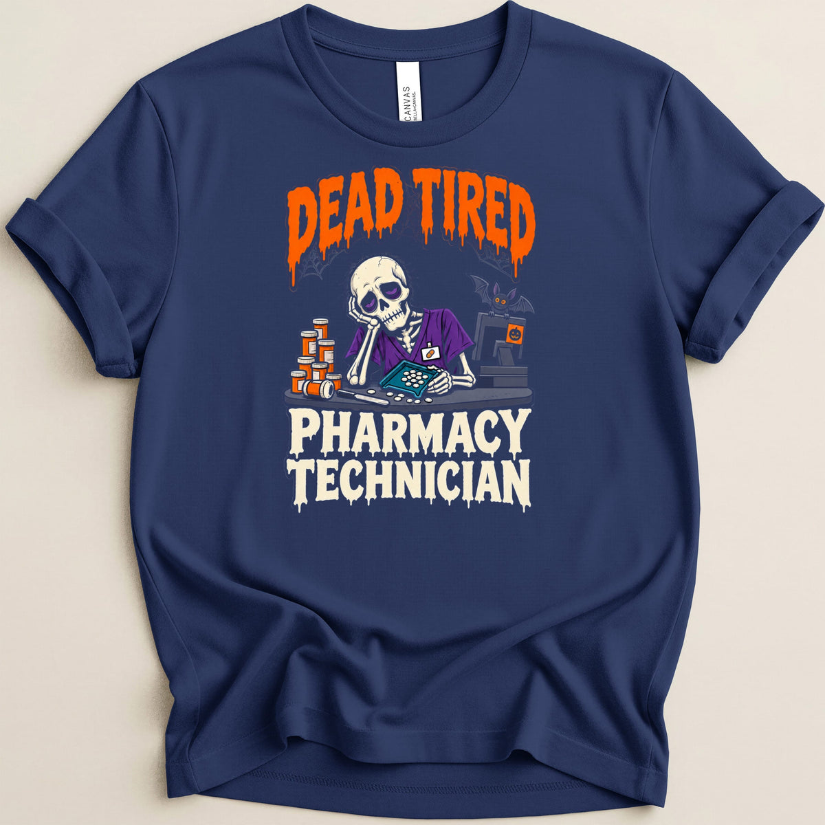 Skeleton graphic on navy t-shirt reads "DEAD TIRED PHARMACY TECHNICIAN".