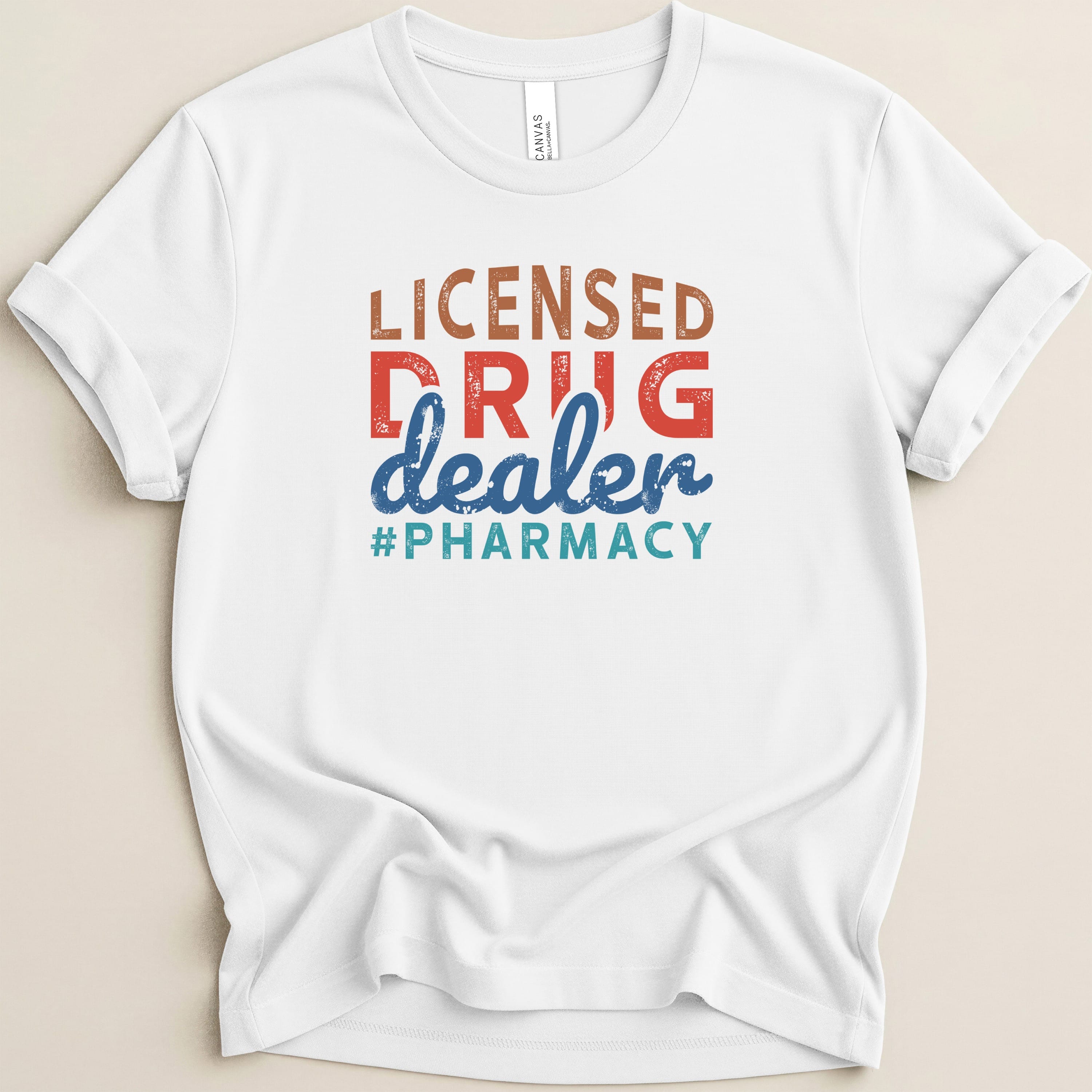 White t-shirt with "Licensed Drug Dealer #Pharmacy" text.