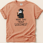 T-shirt with a cartoon plague doctor graphic and text "HAVE YOU TRIED LEECHES?".