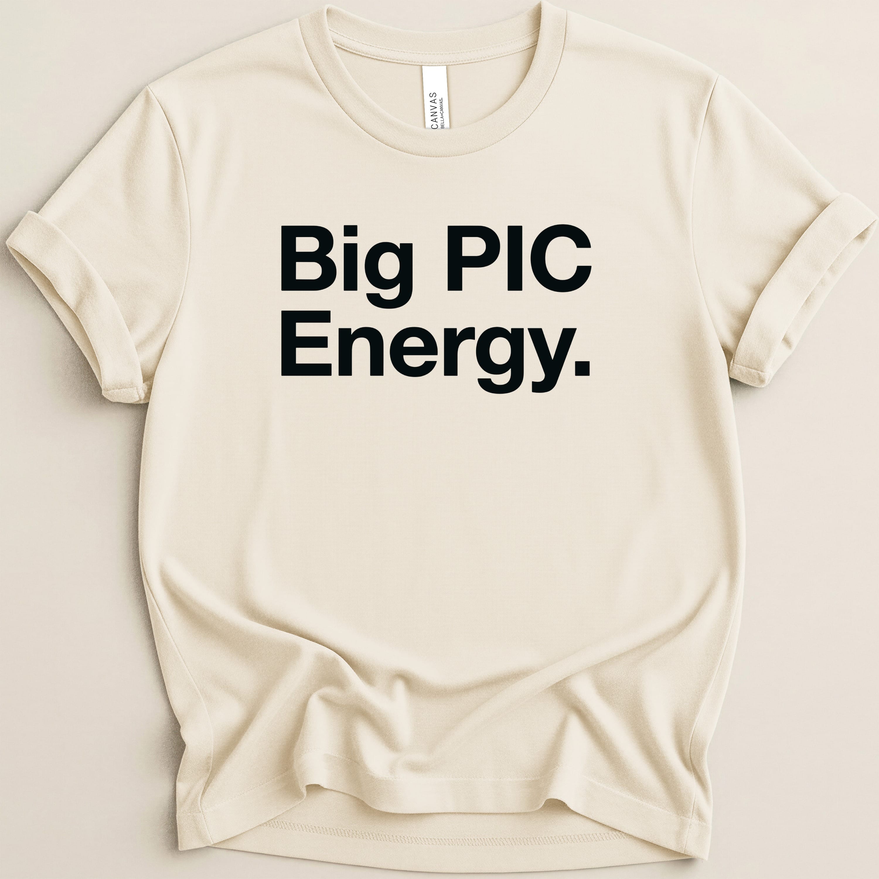 Cream t-shirt with "Big PIC Energy." text in black.