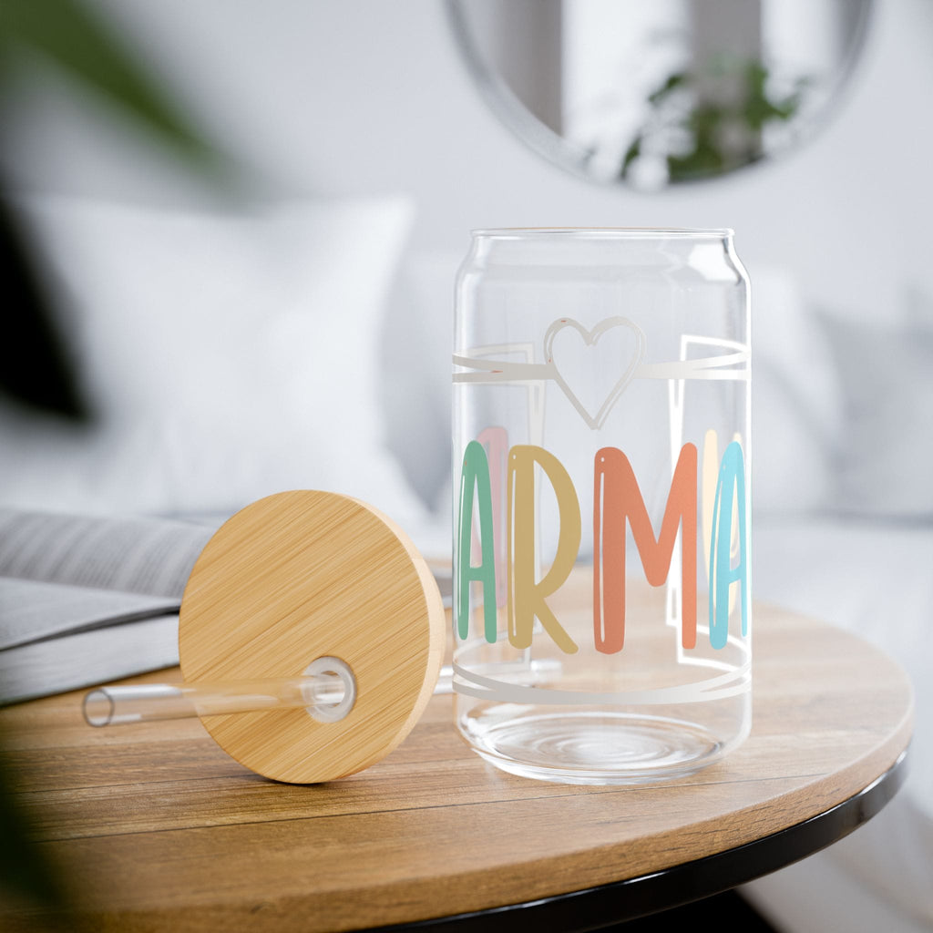 Clear glass can-shaped cup with "ARMA" in colorful letters and a heart.