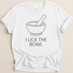 White t-shirt with black line drawing of a mortar and pestle and text "I LICK THE BOWL".