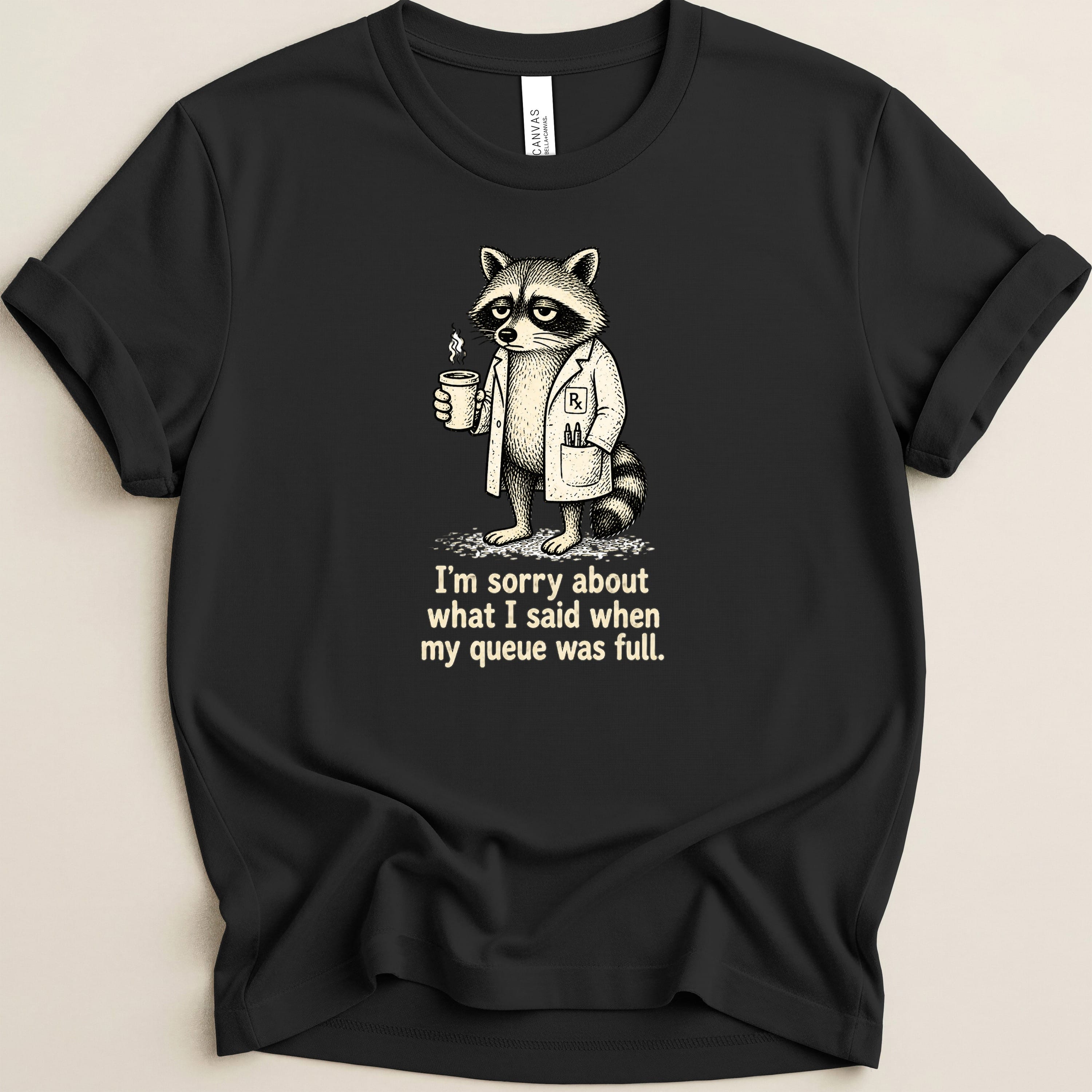 T-shirt with raccoon in lab coat holding coffee, text "I'm sorry about what I said when my queue was full."