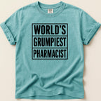Teal t-shirt with black text "WORLD'S GRUMPIEST PHARMACIST".