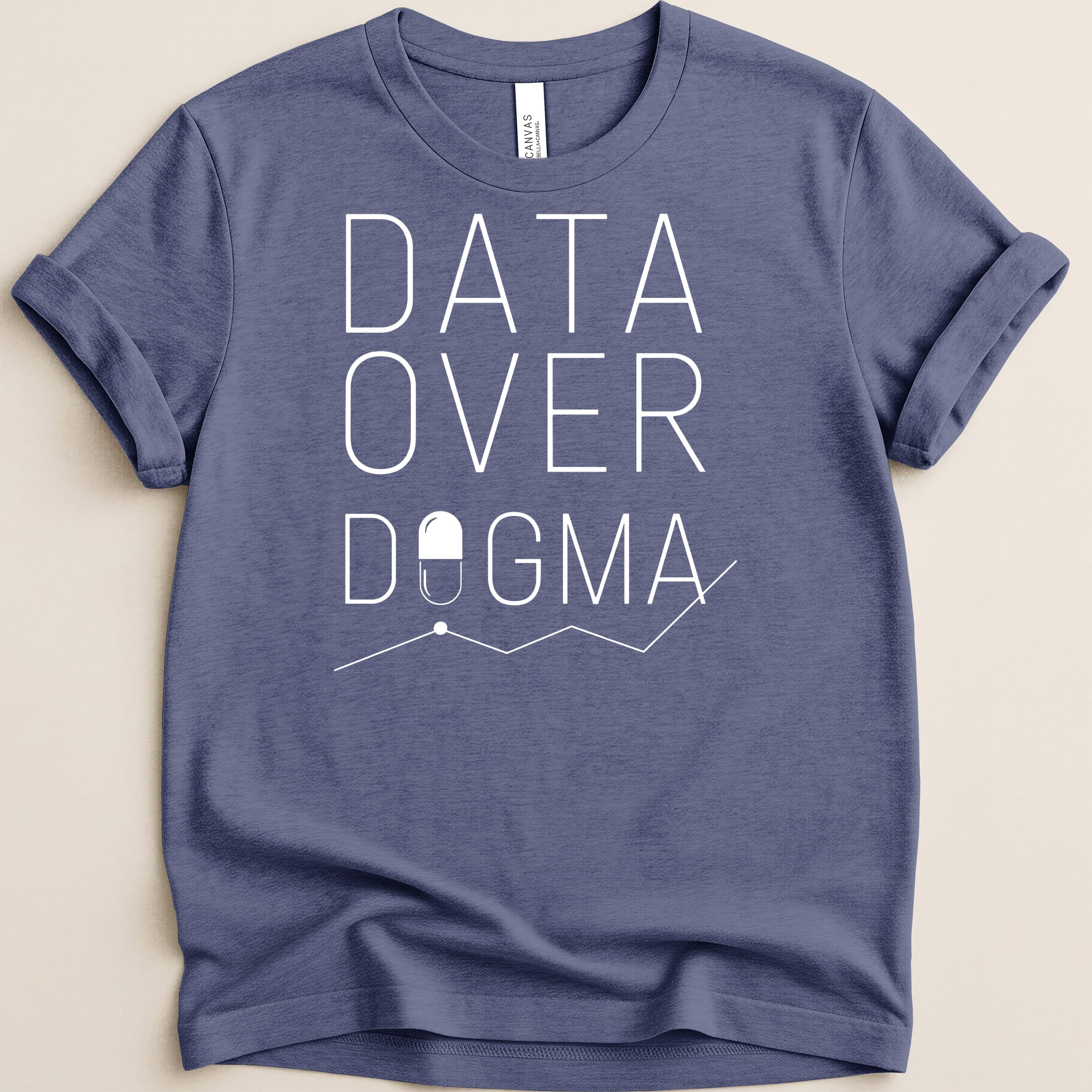 Blue t-shirt with "DATA OVER DOGMA" text and a pill icon with a graph.