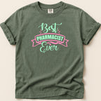 Green t-shirt with "Best Pharmacist Ever" text in pink and mint.