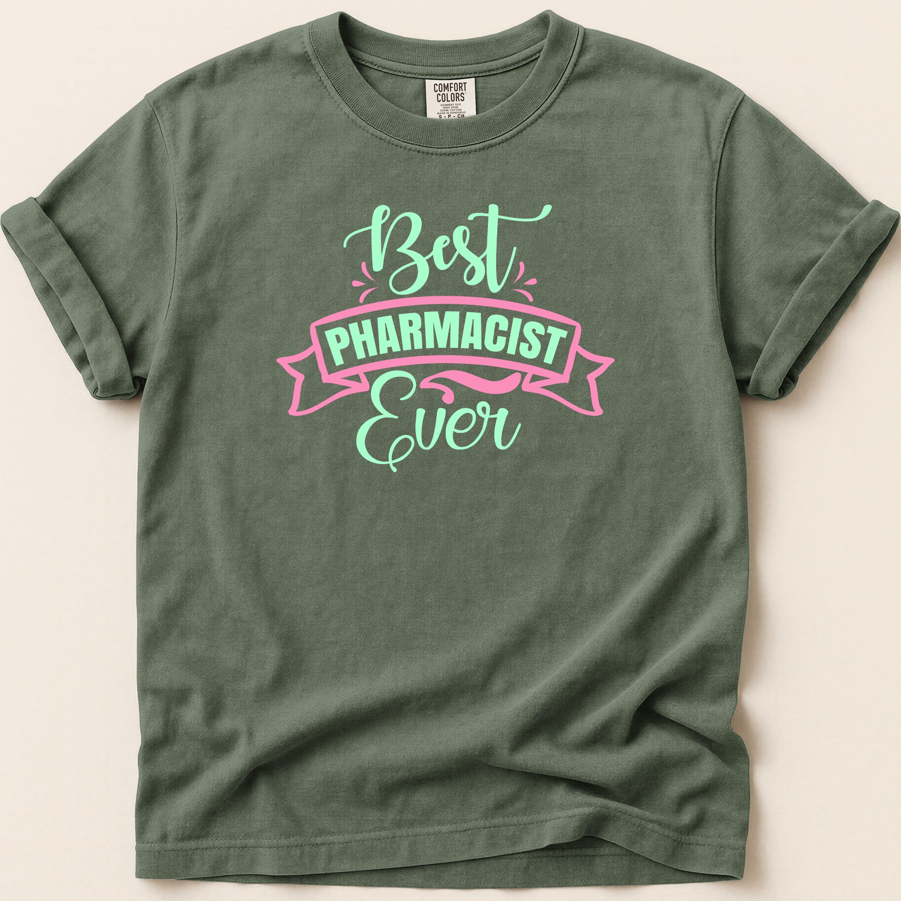 Green t-shirt with "Best Pharmacist Ever" text in pink and mint.
