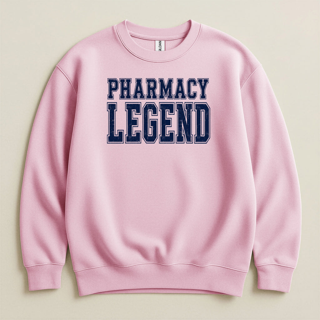 Pink sweatshirt with "PHARMACY LEGEND" text in navy blue lettering.