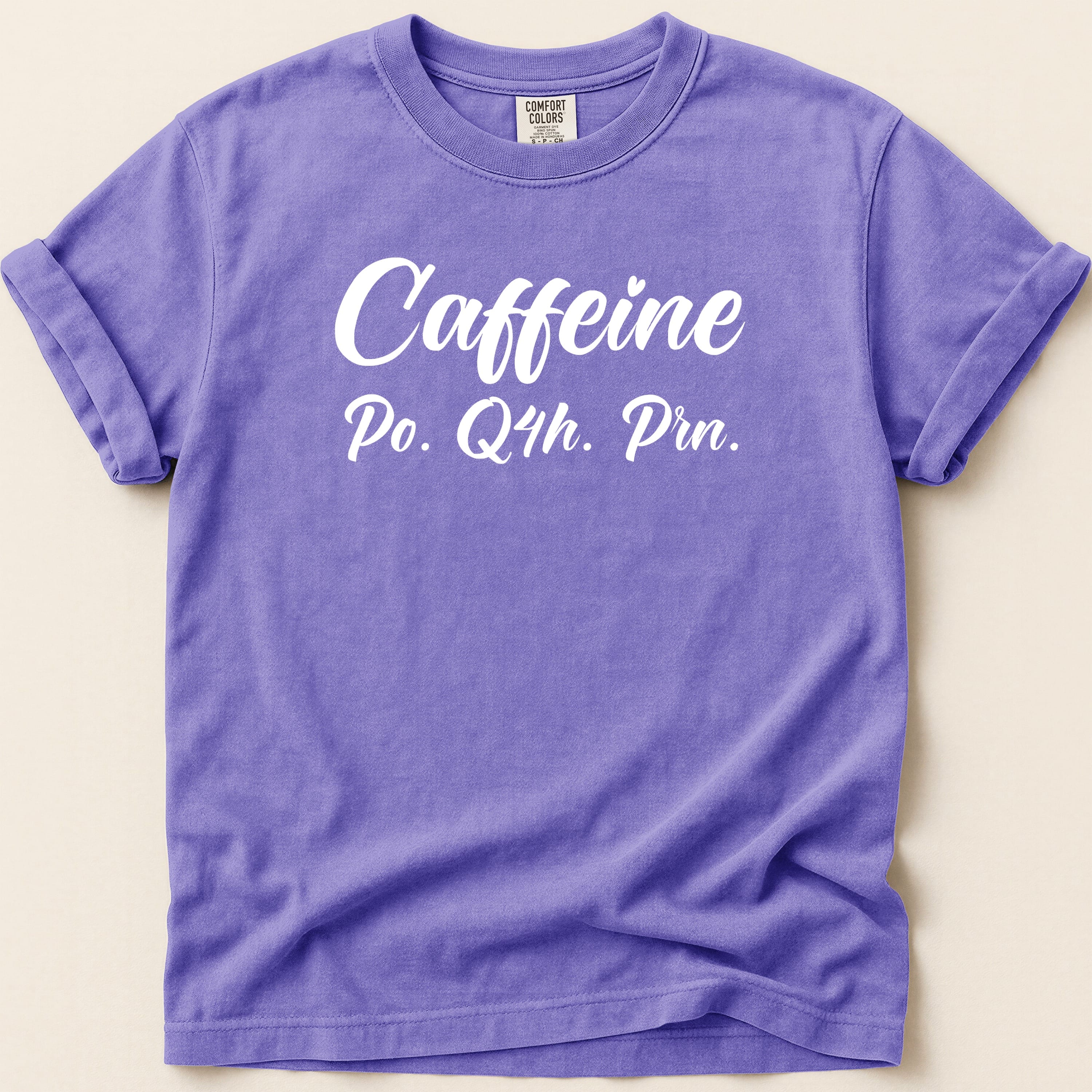 Purple t-shirt with "Caffeine Po. Q4h. Prn." text.