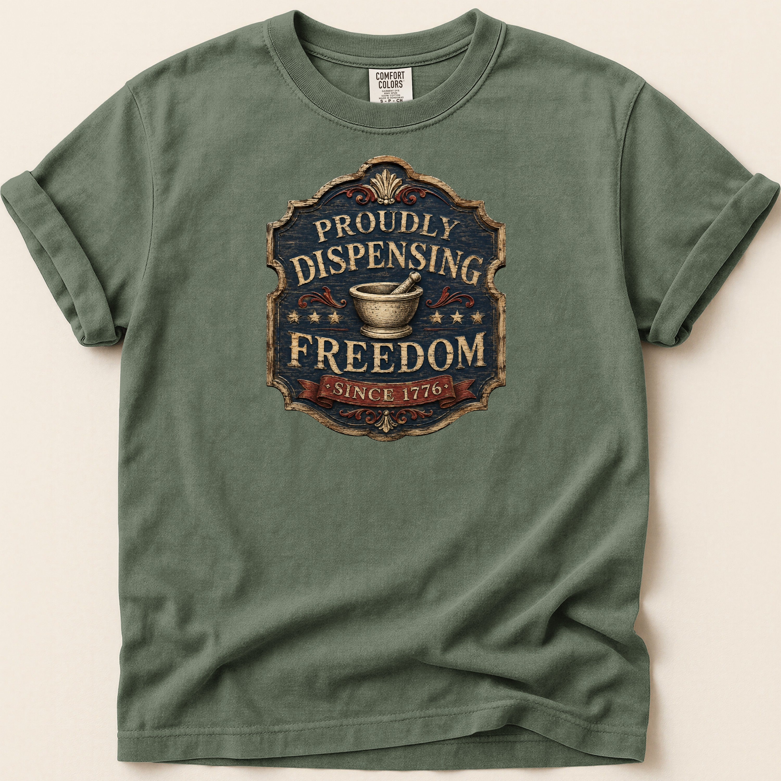 Green t-shirt with "Proudly Dispensing Freedom Since 1776" emblem.