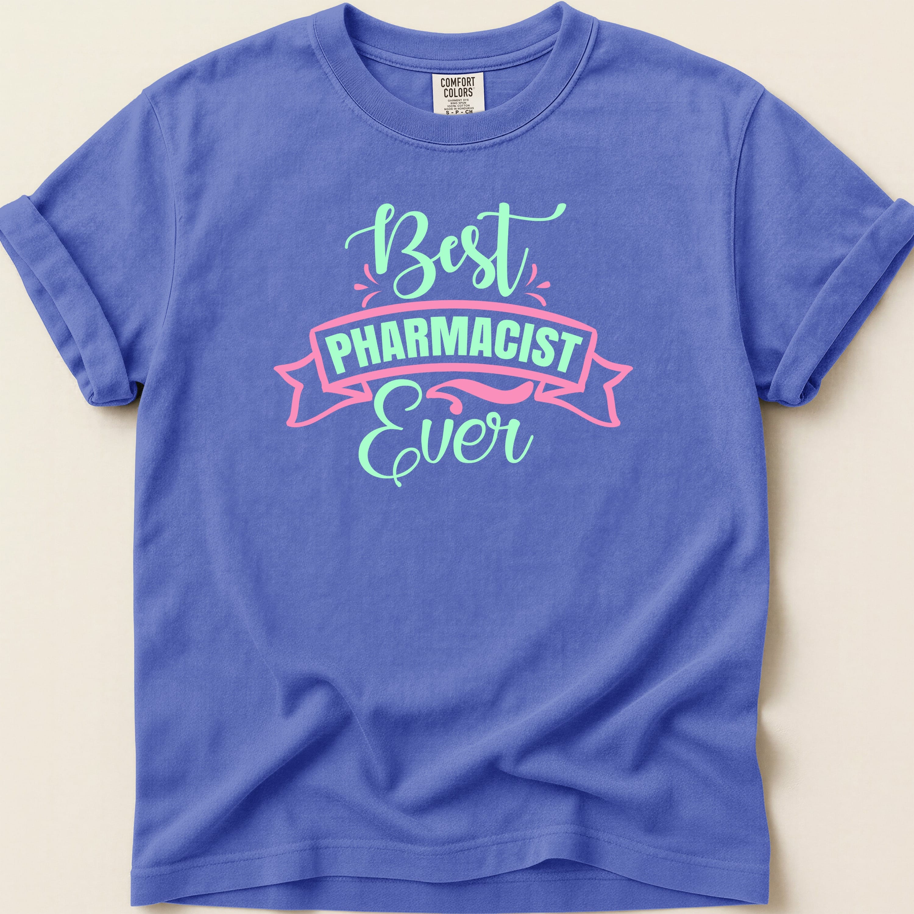 Purple Comfort Colors t-shirt with "Best Pharmacist Ever" text.