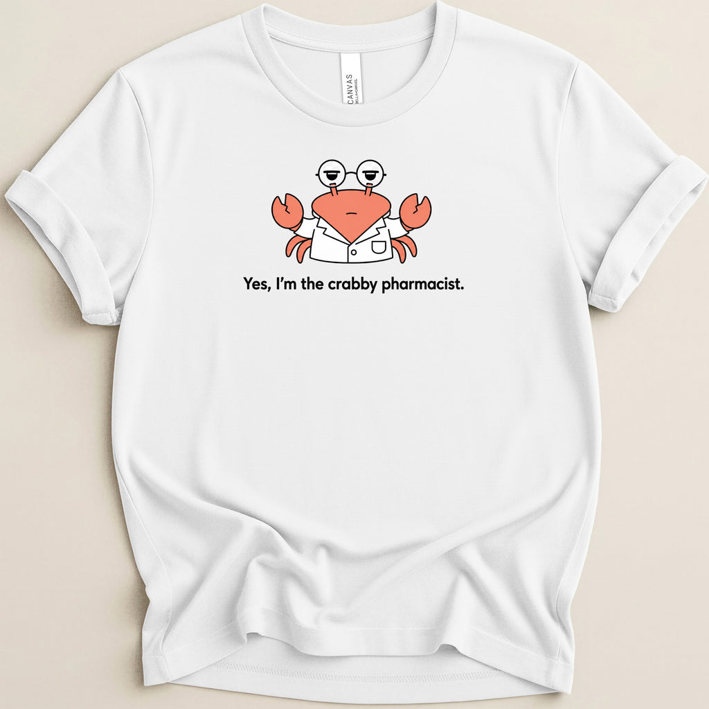 White t-shirt with a cartoon crab wearing glasses and a lab coat that says "Yes, I'm the crabby pharmacist."