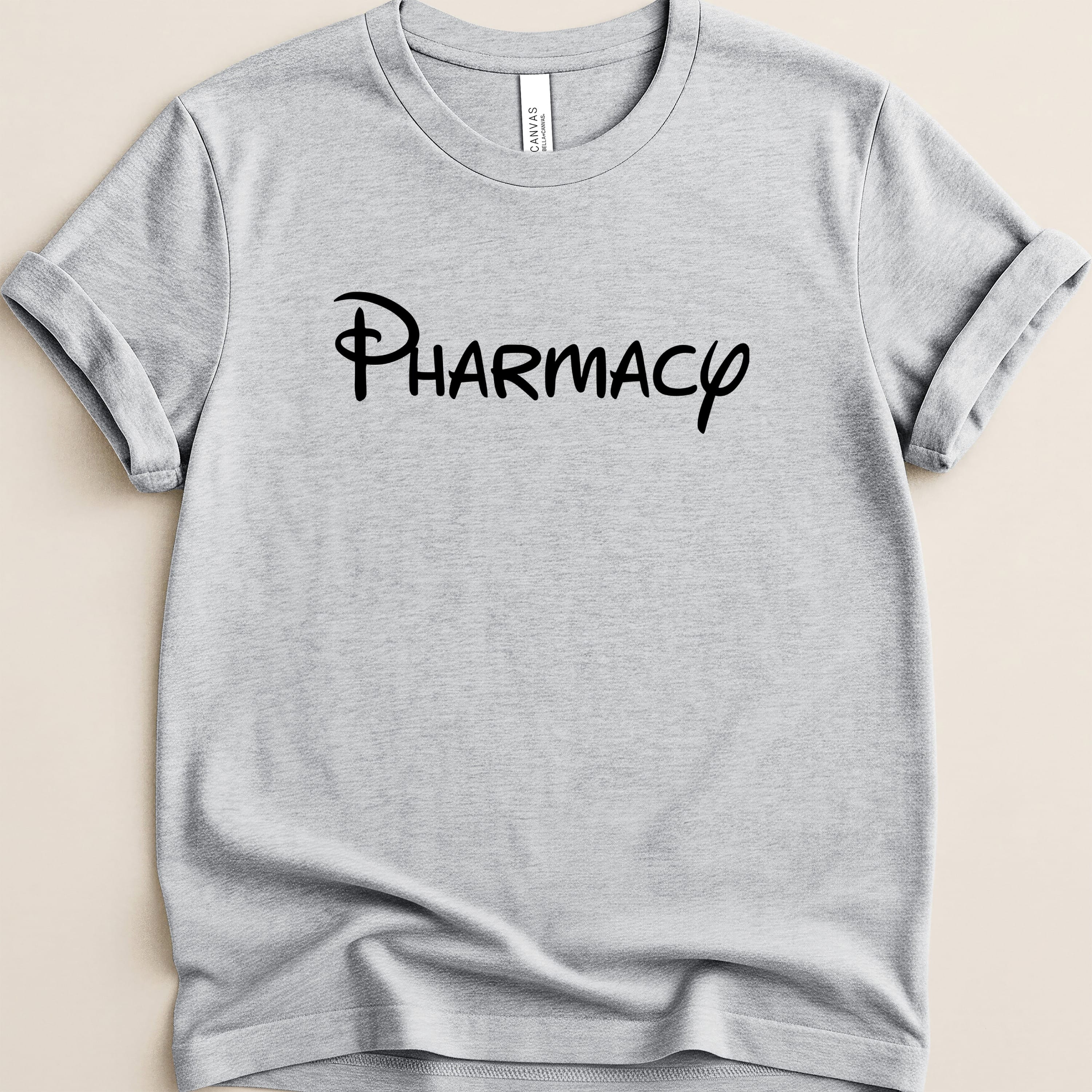 Gray t-shirt with "Pharmacy" in Disney-style font.
