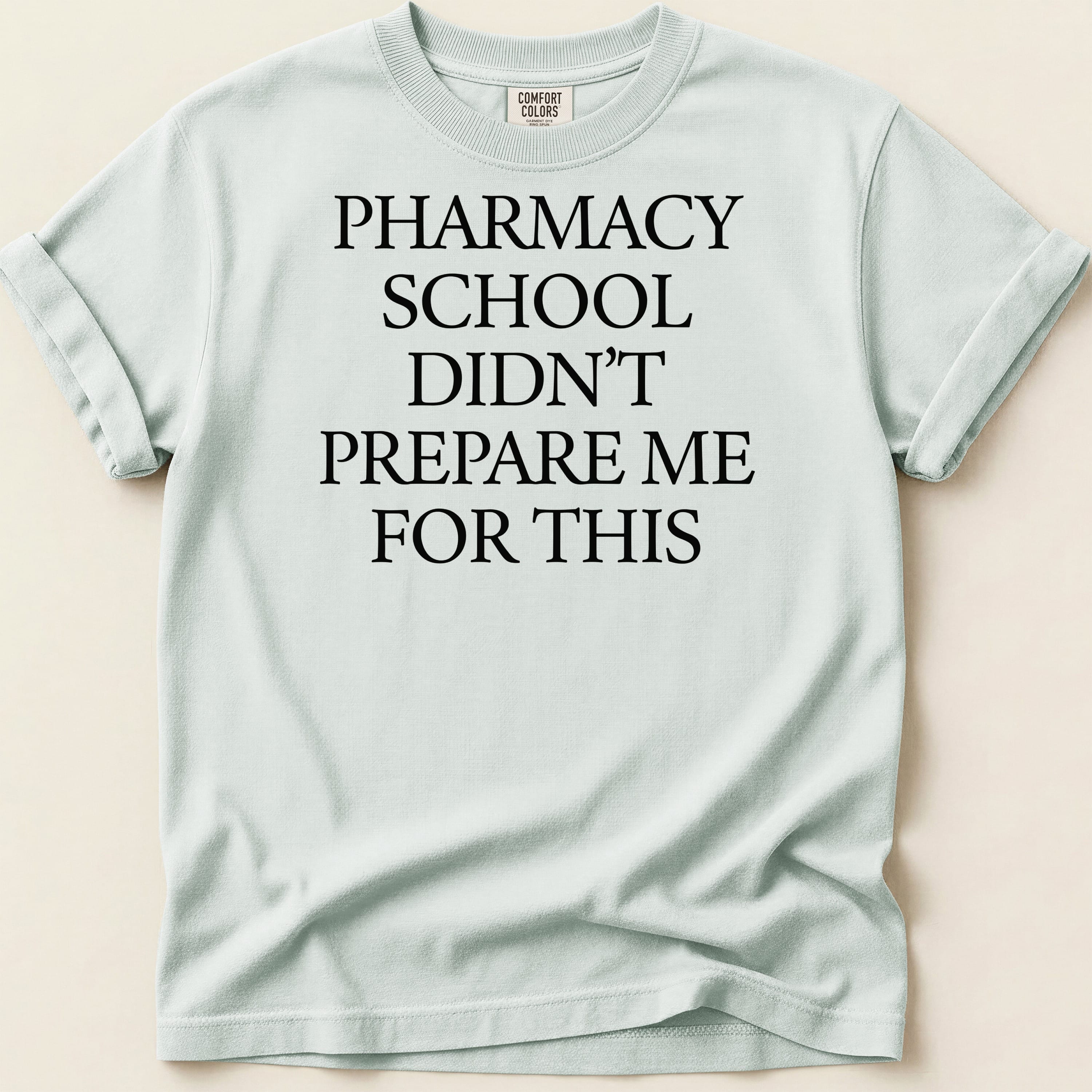 Comfort Colors t-shirt with "PHARMACY SCHOOL DIDN'T PREPARE ME FOR THIS" text.