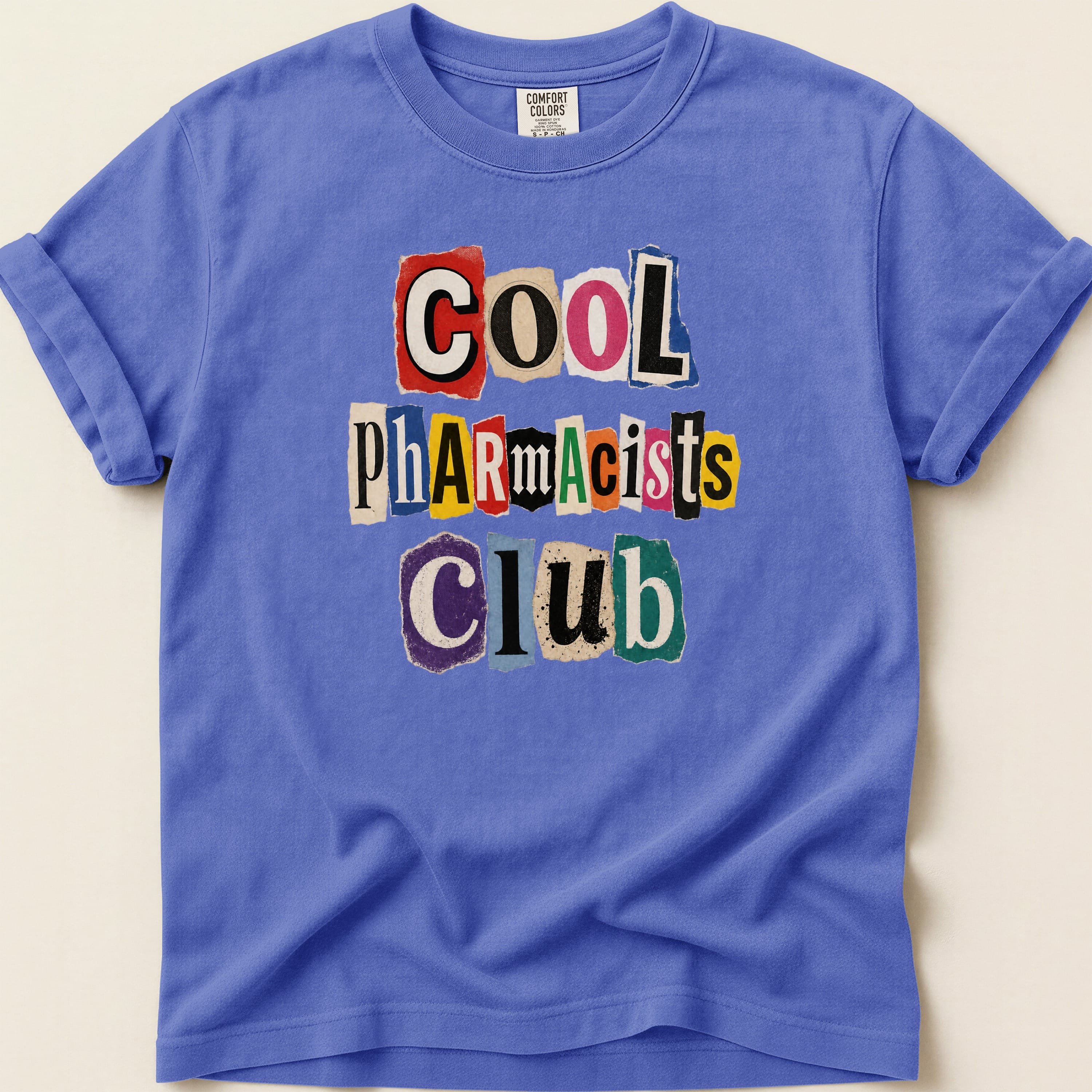 Purple t-shirt with "COOL Pharmacists Club" in ransom note lettering.
