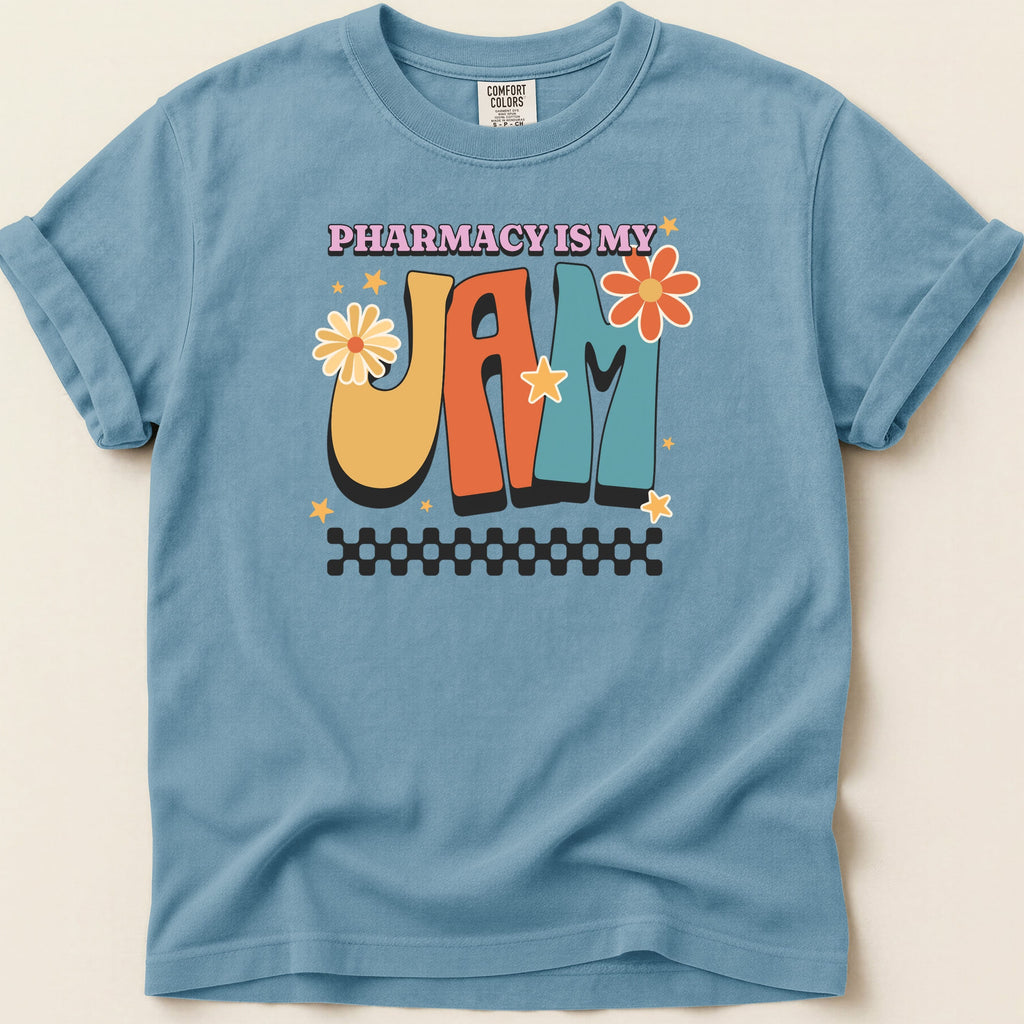 Blue t-shirt with "Pharmacy is My Jam" text and floral graphics.