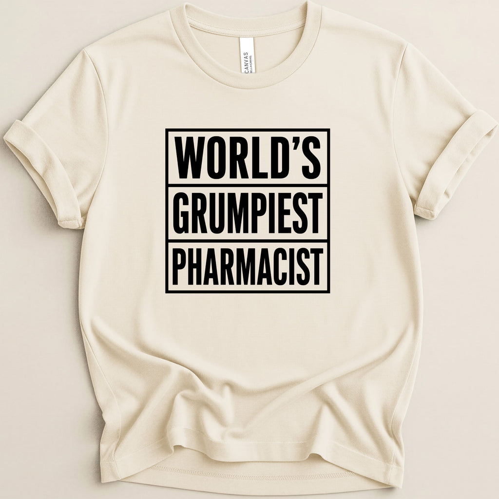 Cream t-shirt with "WORLD'S GRUMPIEST PHARMACIST" in black block letters.