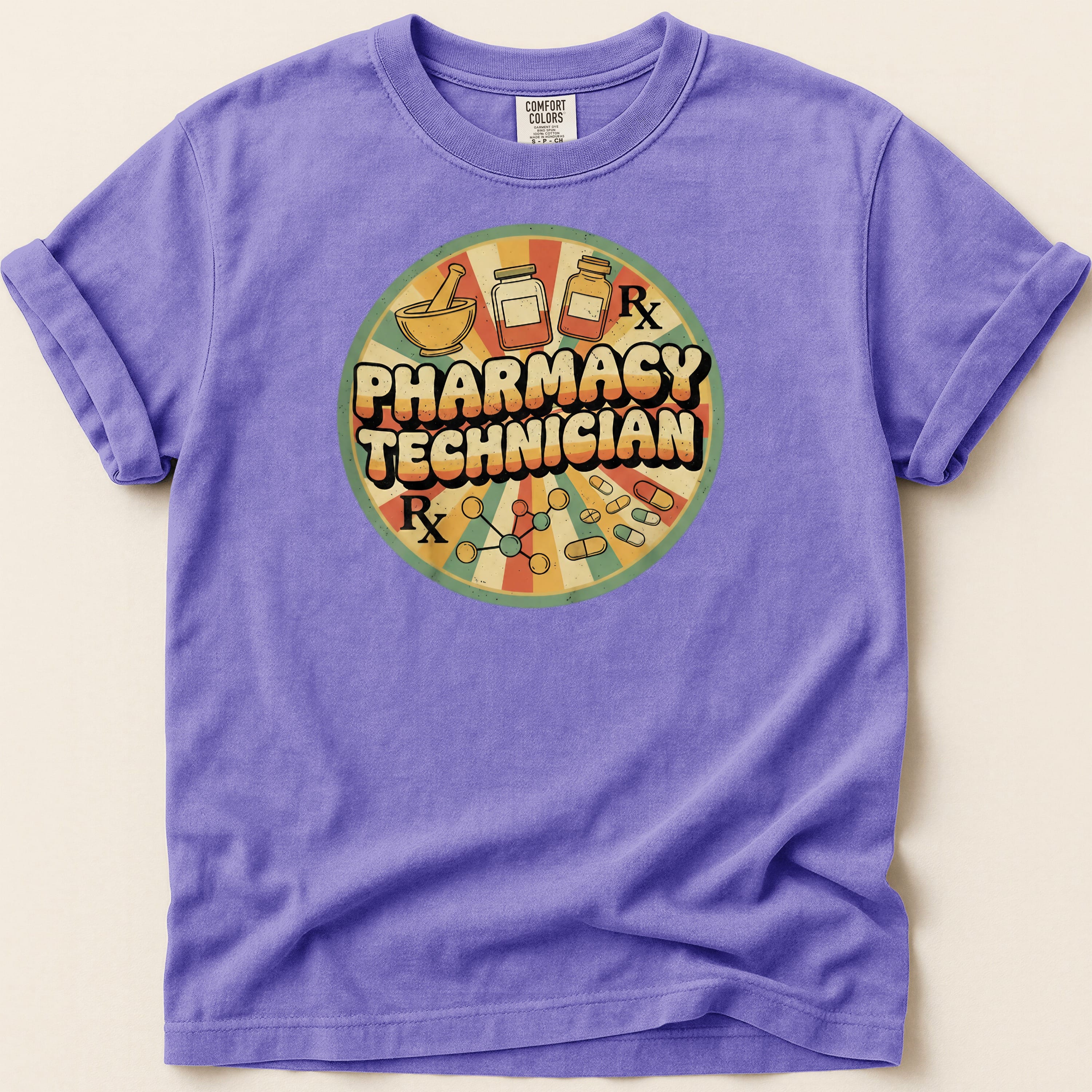 Purple t-shirt with "Pharmacy Technician Rx" in a retro circular graphic.
