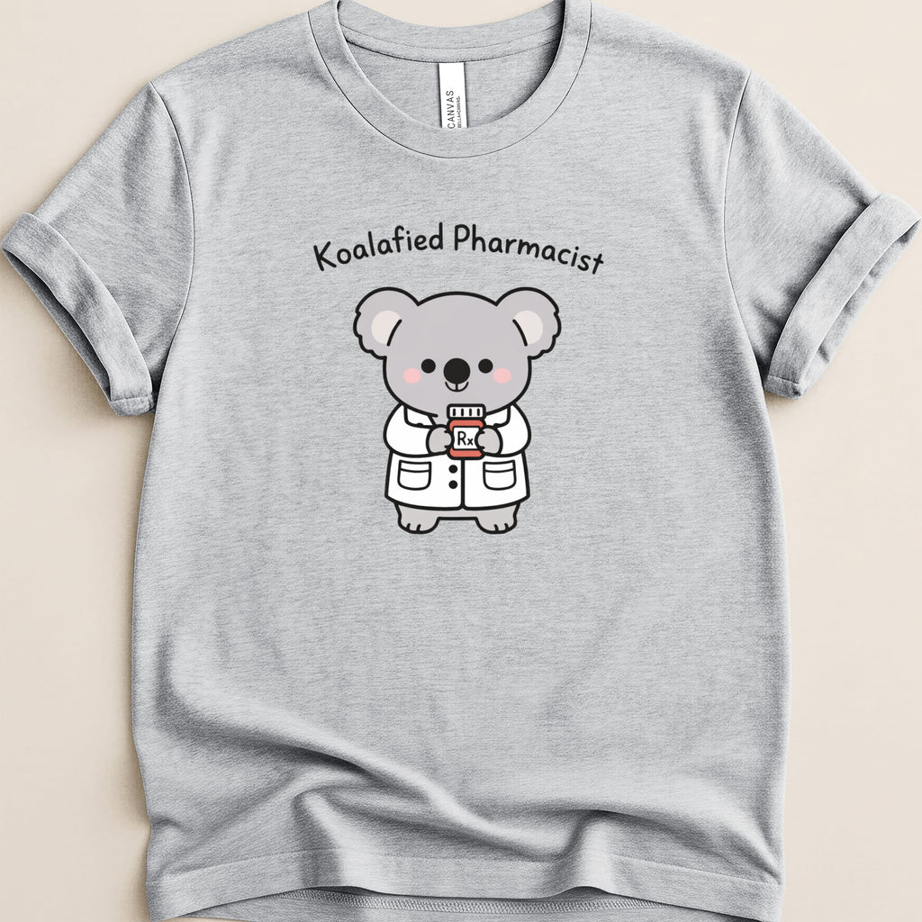 Grey t-shirt featuring a cartoon koala dressed as a pharmacist holding a prescription bottle.