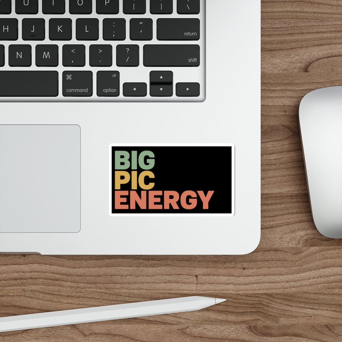Sticker with "BIG PIC ENERGY" in colorful block letters on a laptop.