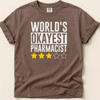 Brown t-shirt with "World's Okayest Pharmacist" and three star ratings.