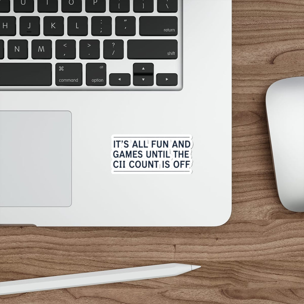 Sticker on a laptop keyboard reading "It's all fun and games until the CII count is off."
