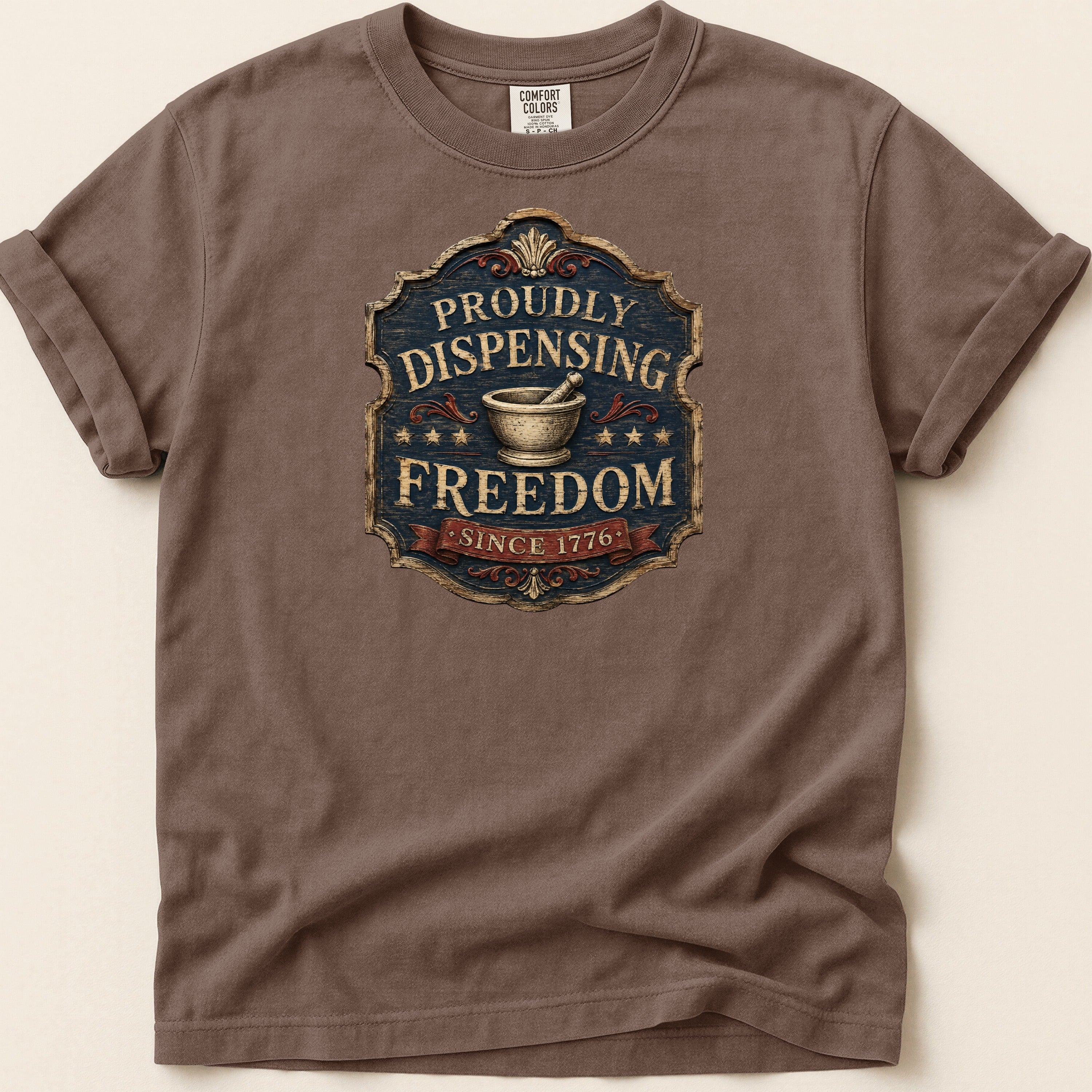 Brown t-shirt with "Proudly Dispensing Freedom Since 1776" emblem.