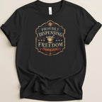 Black t-shirt with "Proudly Dispensing Freedom Since 1776" emblem.