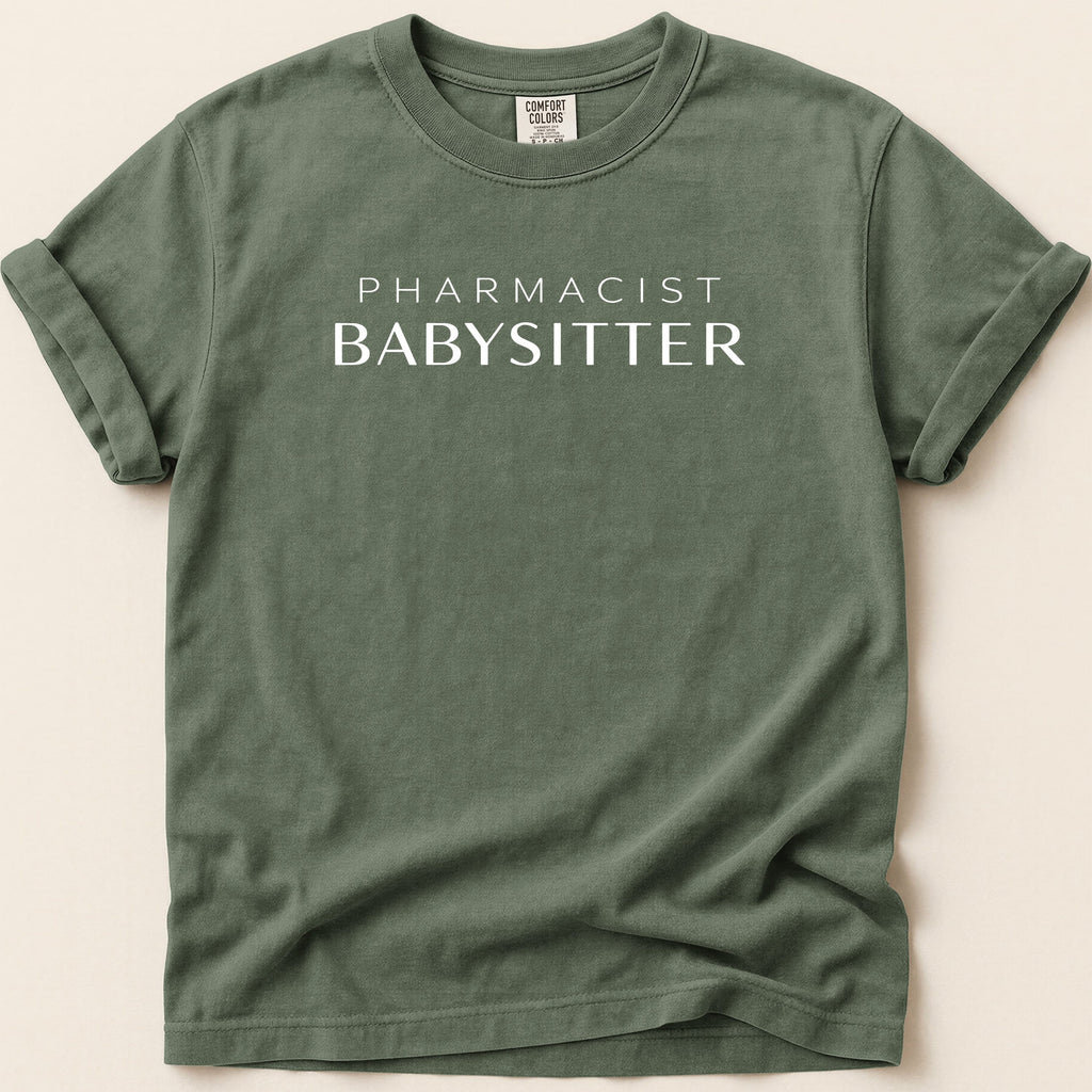 Green t-shirt with white text "Pharmacist Babysitter".