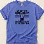 T-shirt with text "My wife is a pharmacist. She hasn't killed me, yet but she knows how."