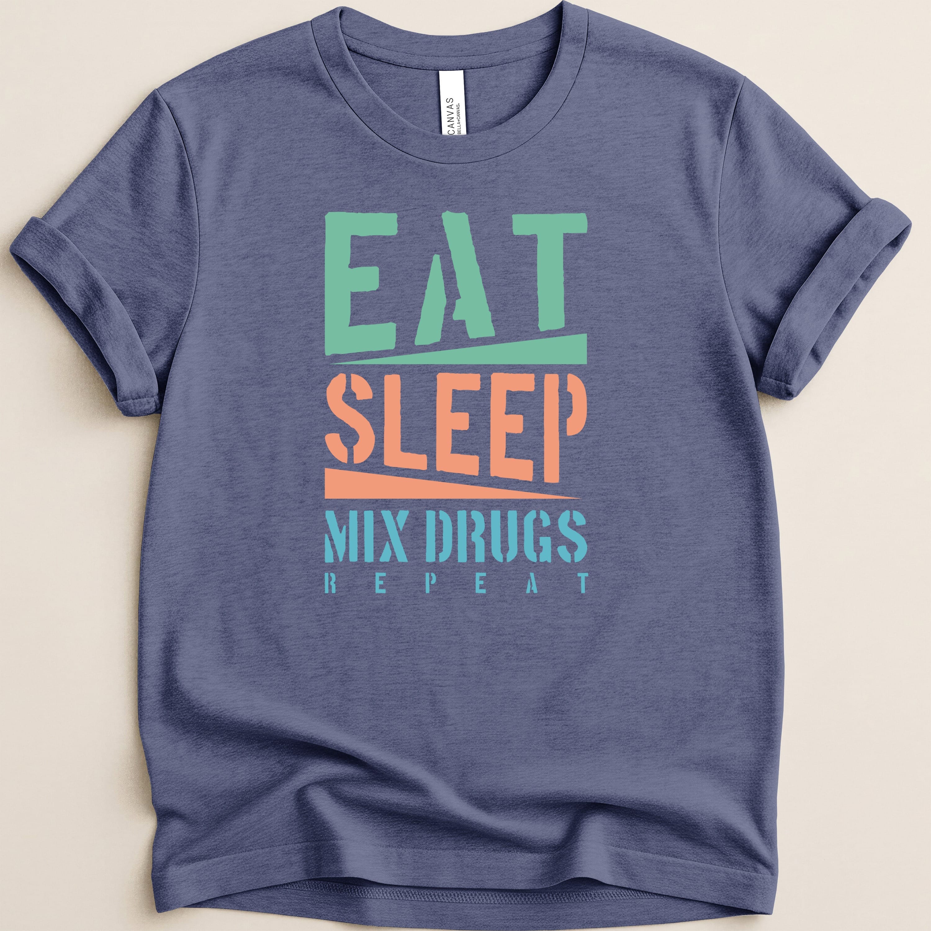 T-shirt with "Eat Sleep Mix Drugs Repeat" in green, orange, and blue text.