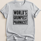 Gray t-shirt with "World's Grumpiest Pharmacist" in bold black text.