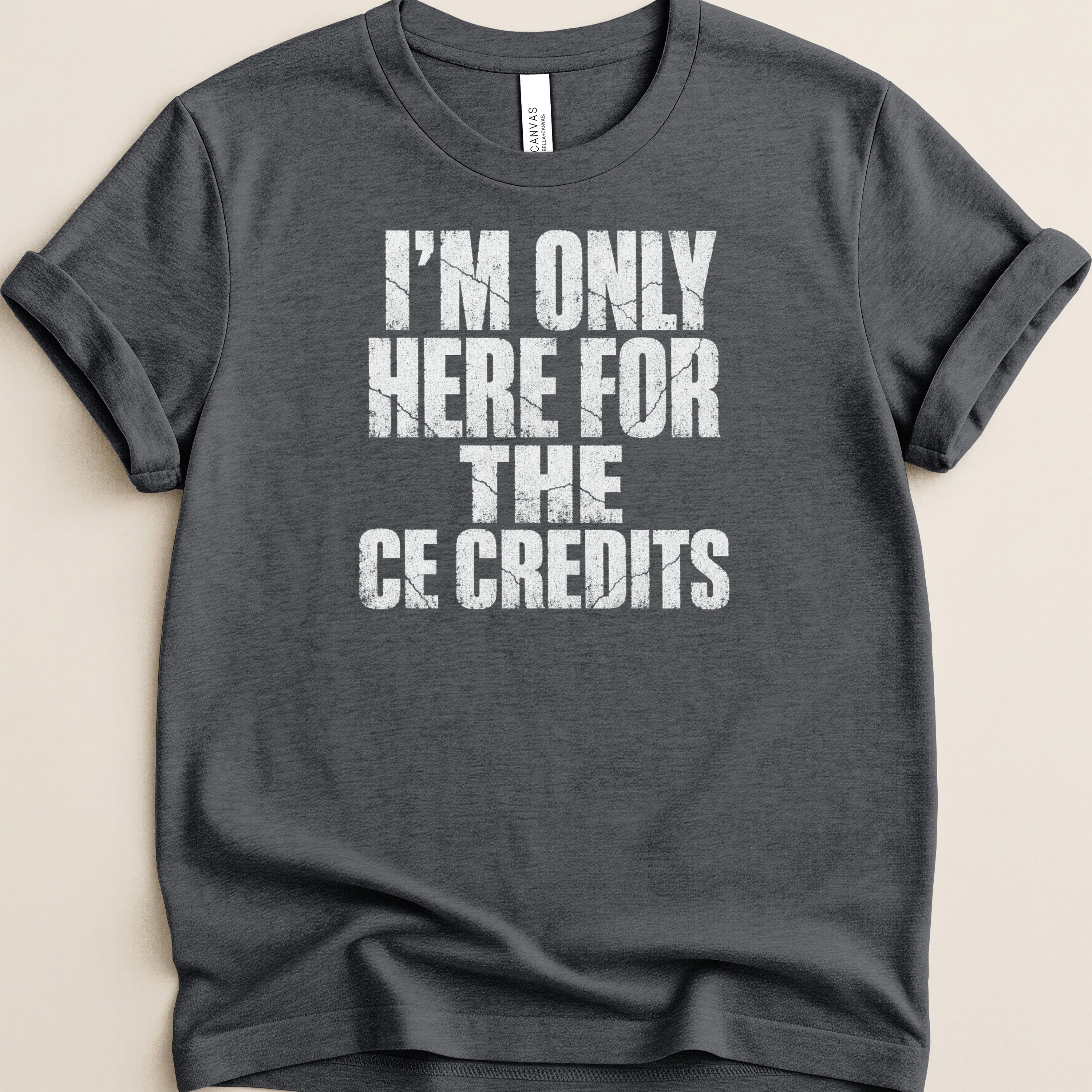 Dark grey t-shirt with white text "I'M ONLY HERE FOR THE CE CREDITS".