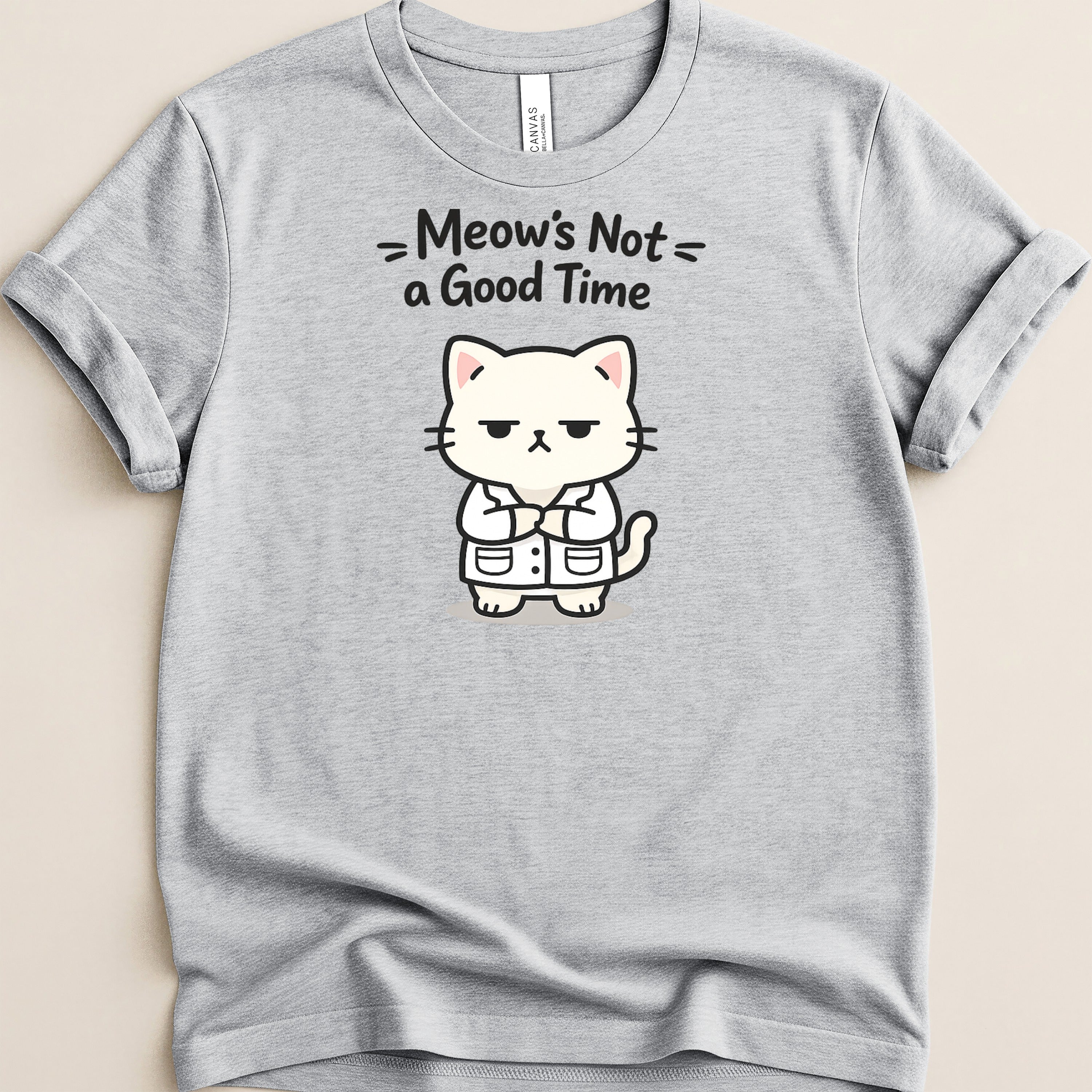 Gray t-shirt with a grumpy cartoon cat in a lab coat and text "Meow's Not a Good Time".