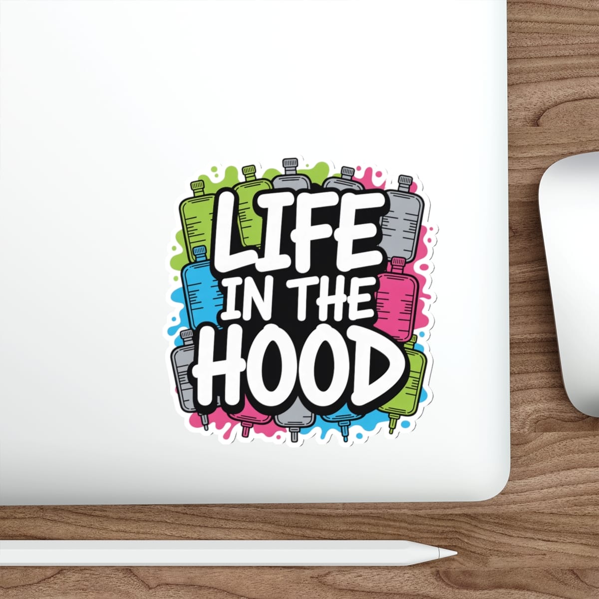 Sticker with colorful text "Life in the Hood" inside cartoon bottle shapes.