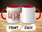 White mug with red interior and handle, "All you'll need is love" text.