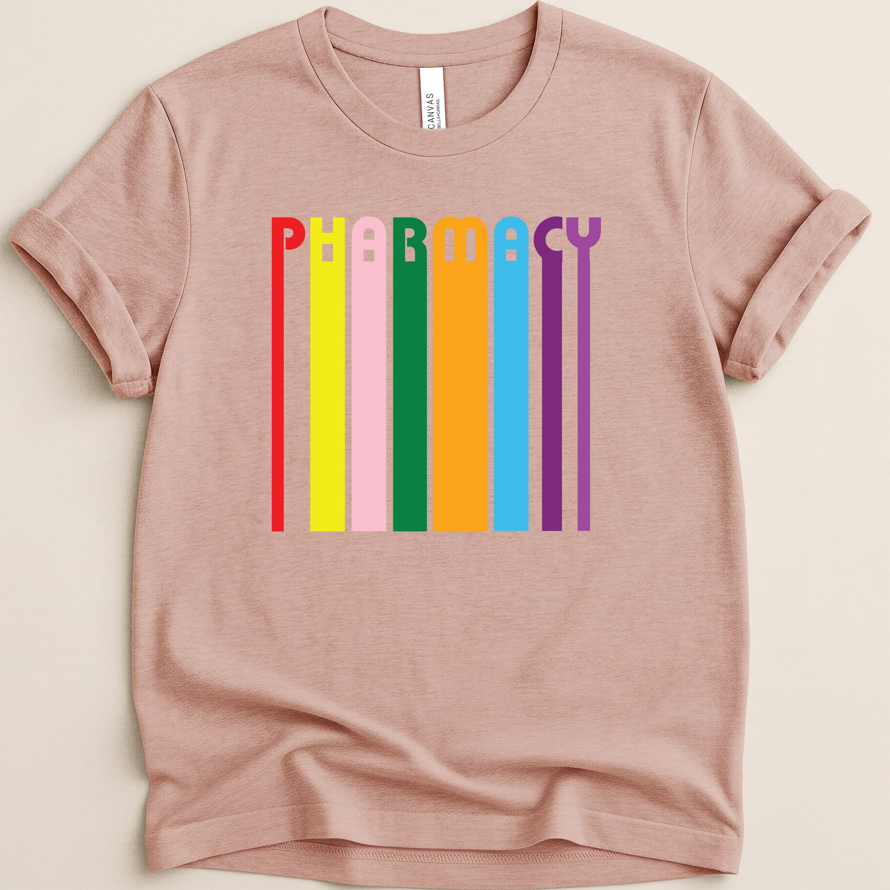 Pink t-shirt with colorful "PHARMACY" text design.