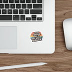 Sticker with text "THAT SOUNDS LIKE A DAY SHIFT PROBLEM" on a laptop.