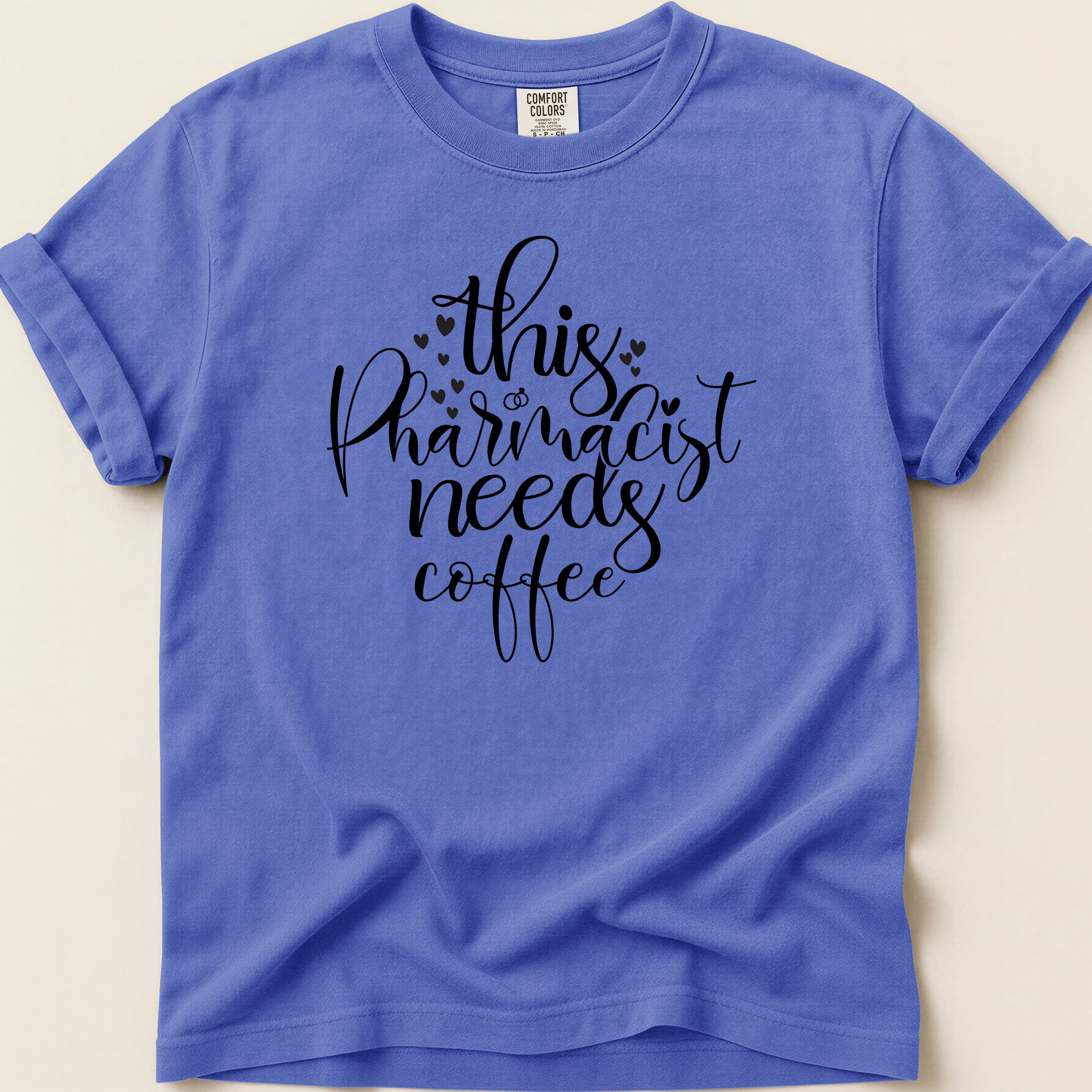 Comfort Colors t-shirt with "This pharmacist needs coffee" text.