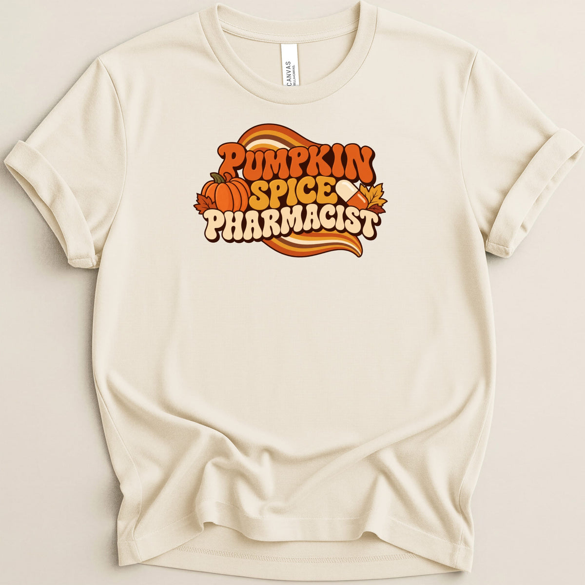 Cream crewneck t-shirt featuring a retro fall graphic that reads Pumpkin Spice Pharmacist.