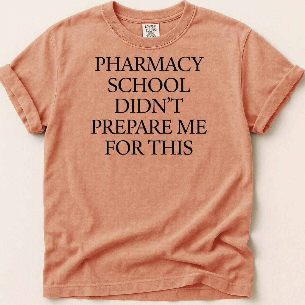 Orange t-shirt with "Pharmacy school didn't prepare me for this" in black text.