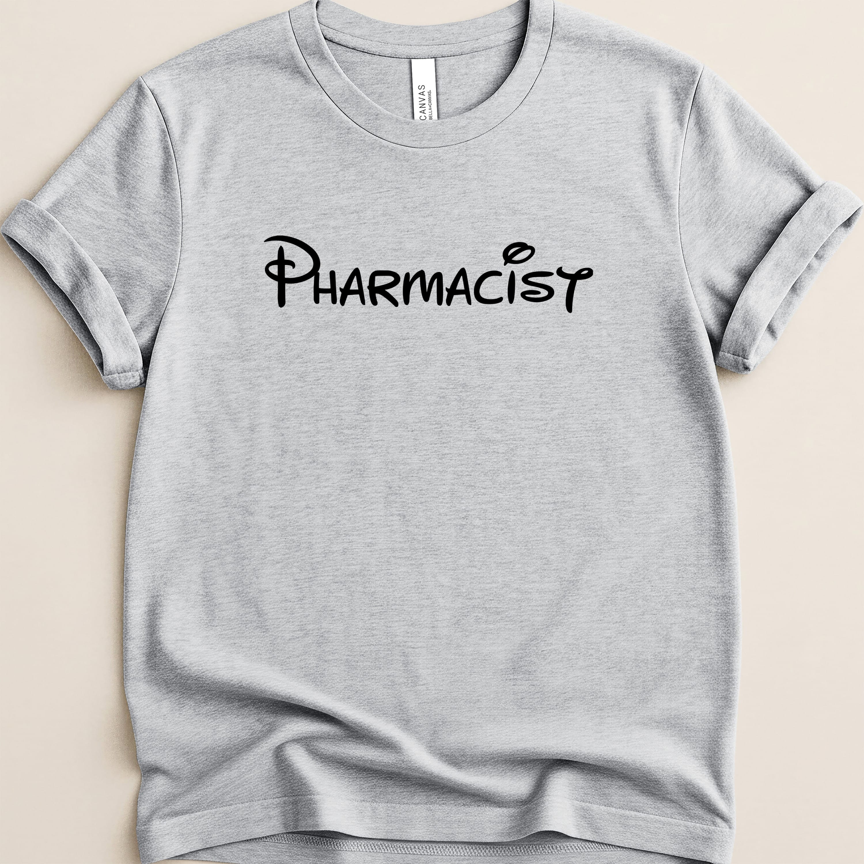 Gray t-shirt with "Pharmacist" in a Disney-style font.